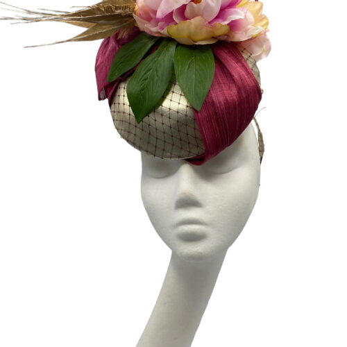 Gold based percher headpiece with stunning burgundy silk abaca detail and finished with pink flowers.